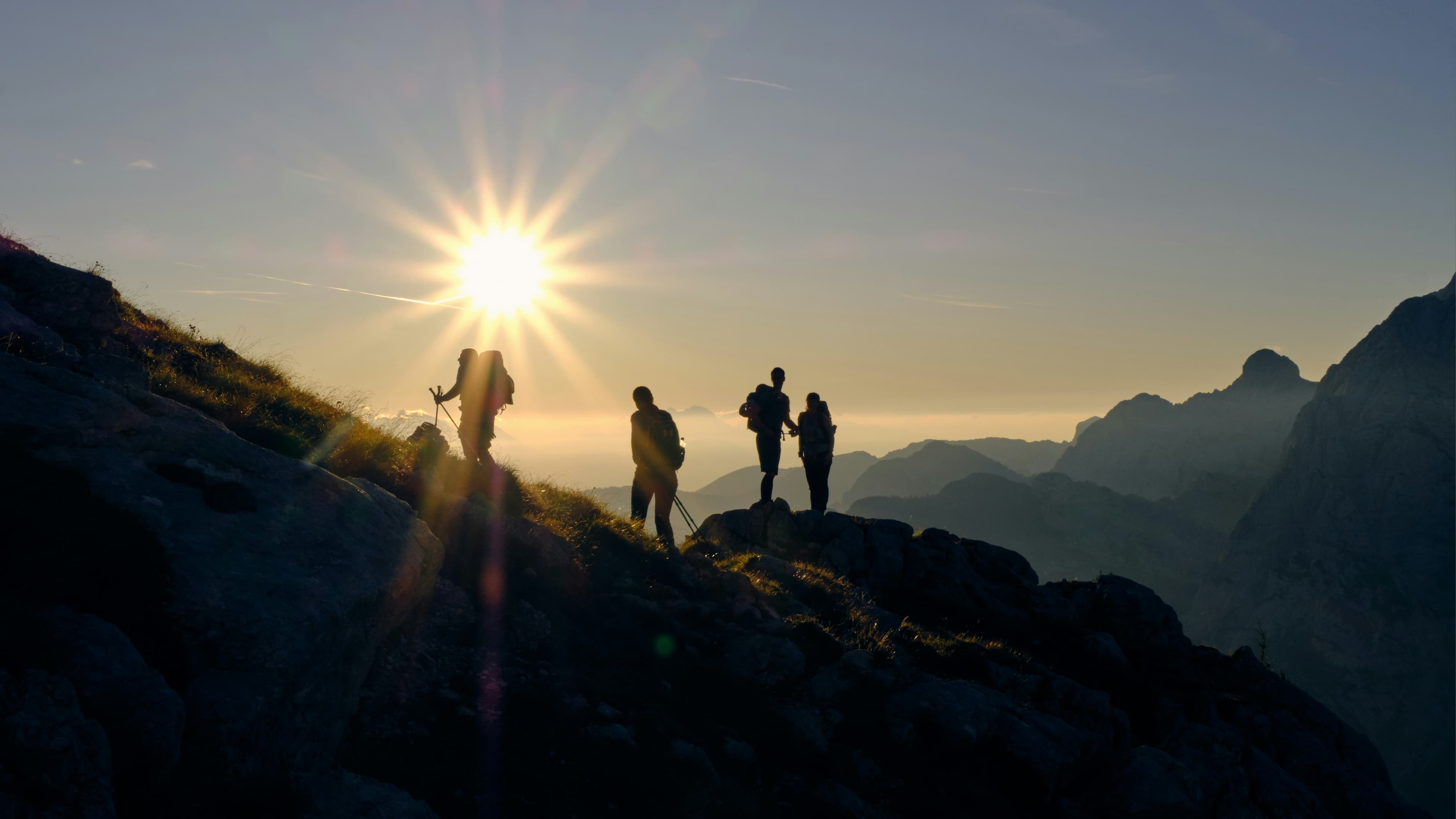 four person on mountain during daytime  h15p84GY5k